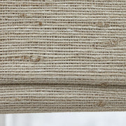 Close-up of the D039 gray-beige weave with natural slubs on the folds of a woven Roman shade