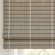 Close-up of the D1303 silver-gray weave with taupe dotted bands on the folds of a woven Roman shade