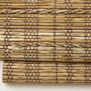 Close-up of the D833 golden straw weave with twisted cord bands on the folds of a woven Roman shade