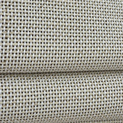 Close-up of the DU01 white and light gray fine basket weave on the folds of a woven Roman shade