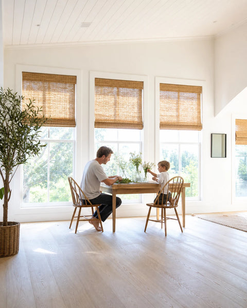 Natural woven bamboo shade in a cozy California breakfast nook