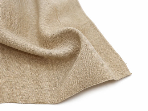 Natural linen fabric draped to show its open texture