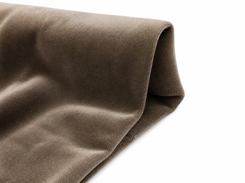 Velvet fabric draped to show its plush directional pile